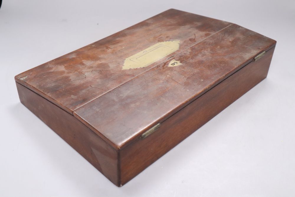A Georgian mahogany tea caddy with associated mixing bowl and a similar writing slope, longest 35.5cm